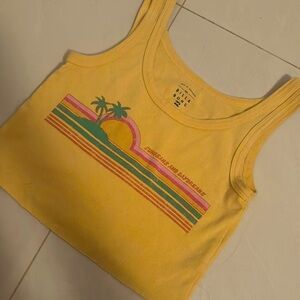 yellow billabong top with cute design in middle